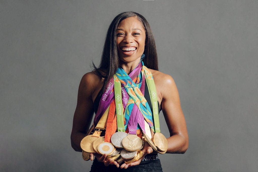 Allyson Felix poses with  her Olympic Medals
